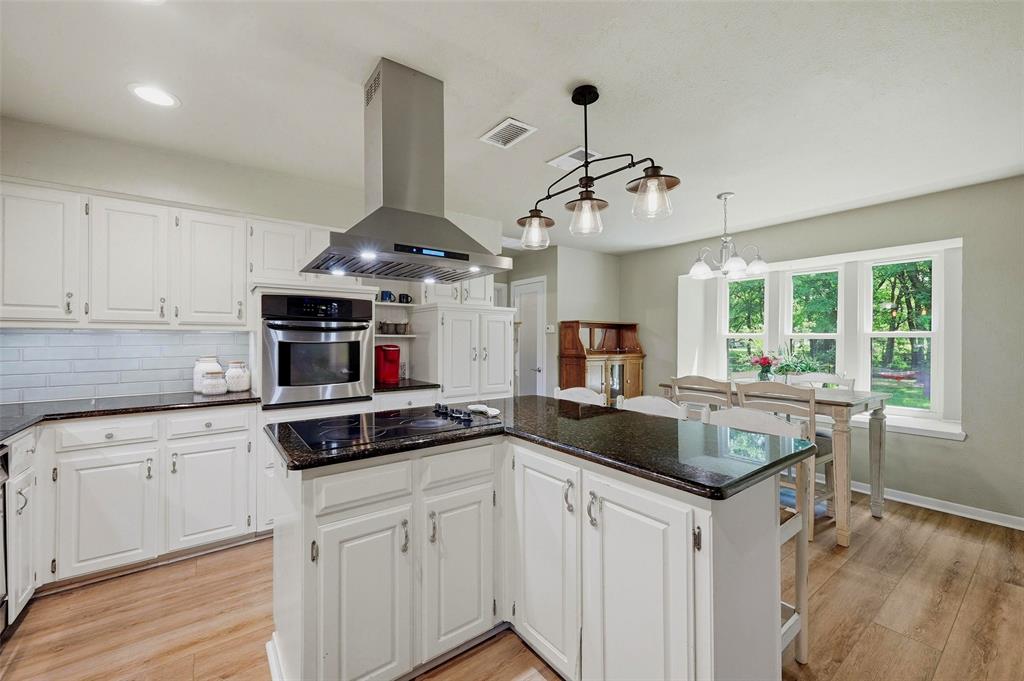 522 High Country Road Sherman, TX 75092 - Photo 8 of 38 a kitchen with stainless steel appliances granite countertop a sink stove and refrigerator