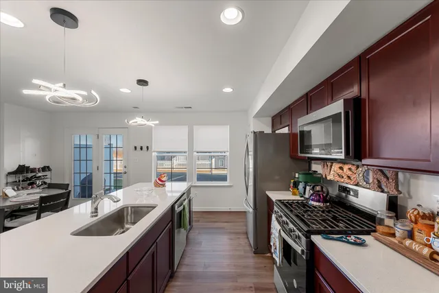 a kitchen with a stove and a sink