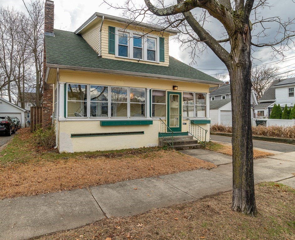 101 Larkspur Street Springfield, MA 01108 - Photo 1 of 35 a front view of a house with a yard and potted plants