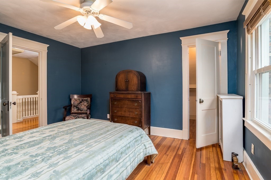 101 Larkspur Street Springfield, MA 01108 - Photo 23 of 35 a bedroom with a bed and a chandelier