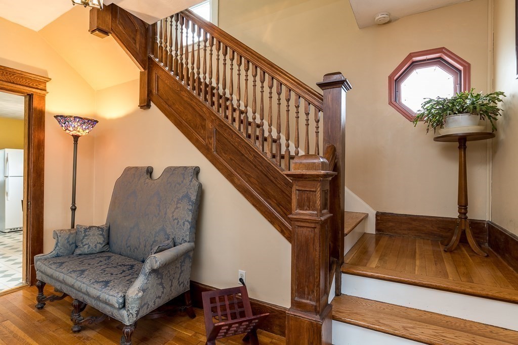 101 Larkspur Street Springfield, MA 01108 - Photo 3 of 35 a view of staircase with wooden floor and a rug