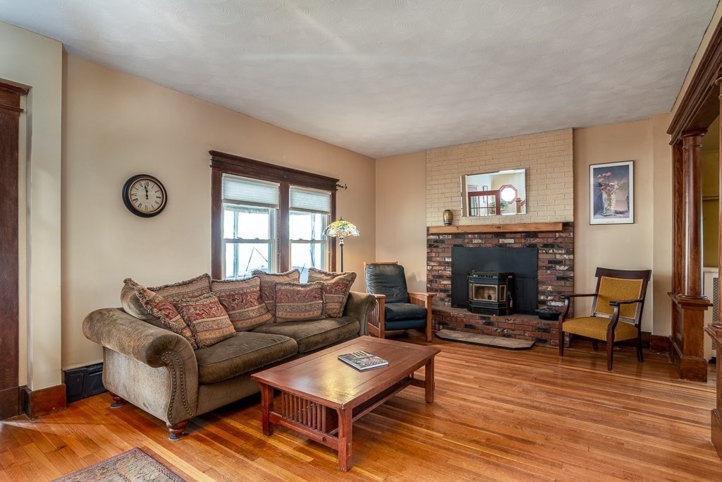 101 Larkspur Street Springfield, MA 01108 - Photo 5 of 35 a living room with furniture and a fireplace