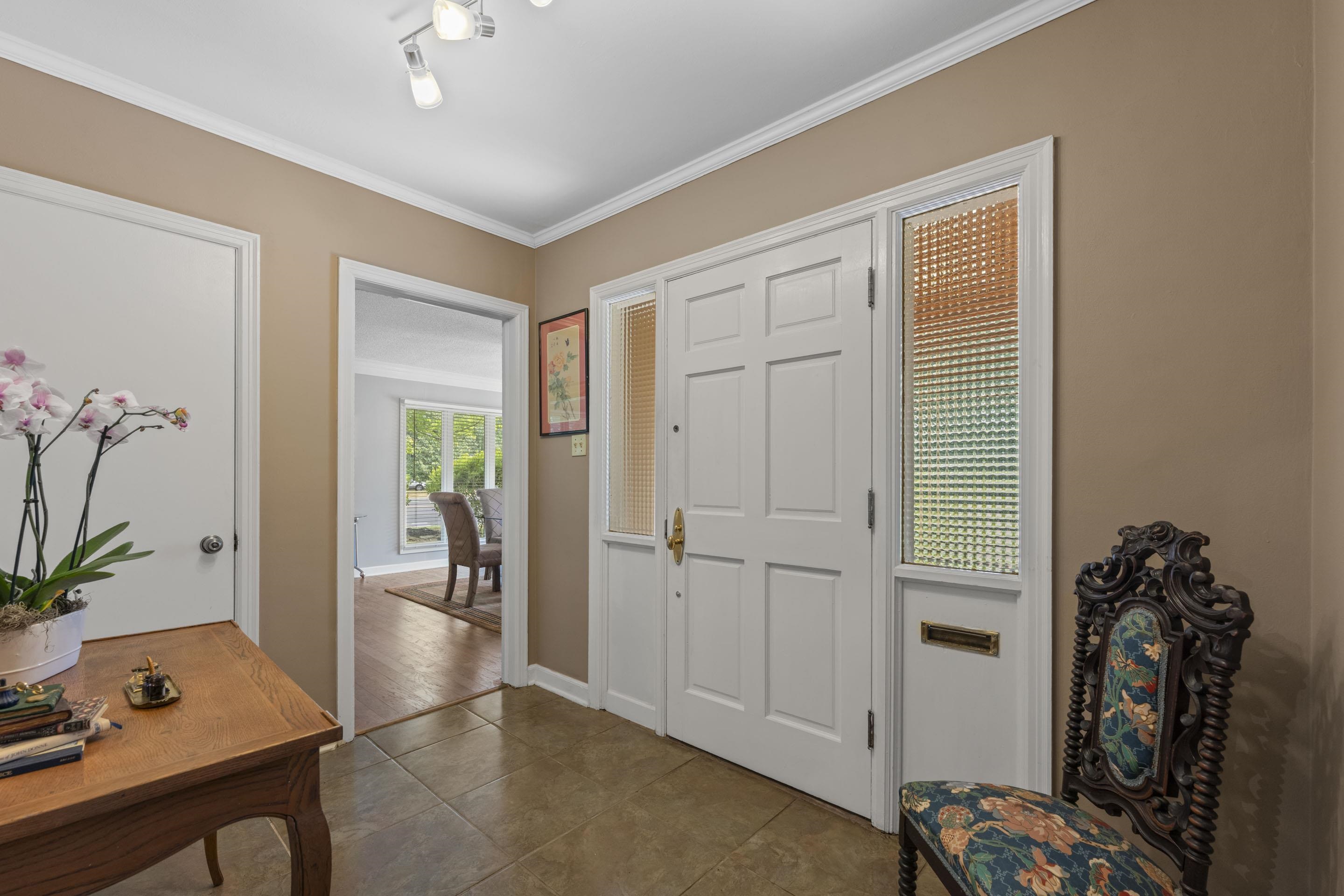 219 North Rose Road Memphis, TN 38117 - Photo 2 of 30 Guests will be impressed the moment they walk through the door and enter into the gracious tiled entry leading to the everyday living spaces.