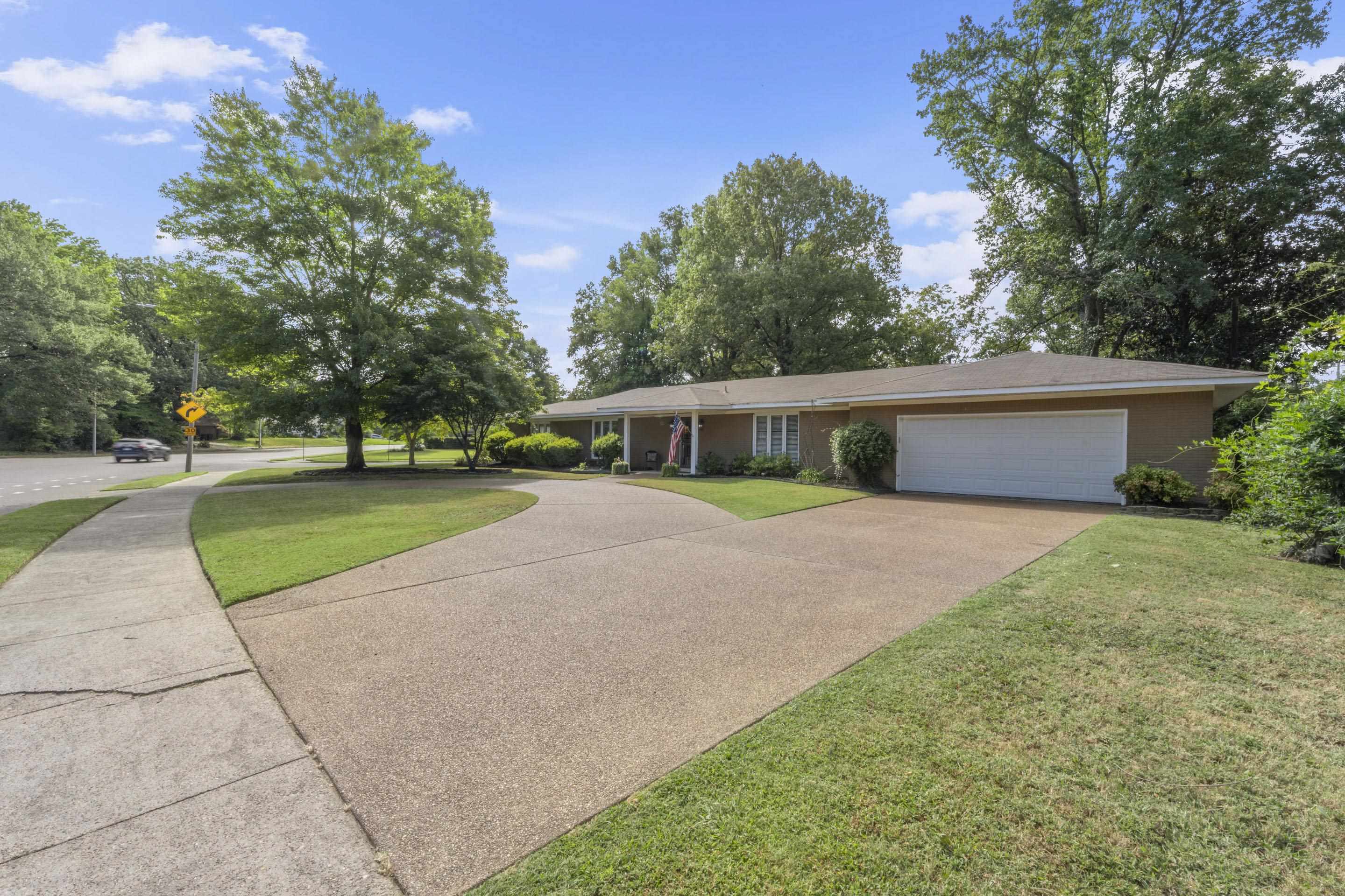 219 North Rose Road Memphis, TN 38117 - Photo 29 of 30 Keep your vehicles safe from the weather elements in the 2 car garage with extra storage.