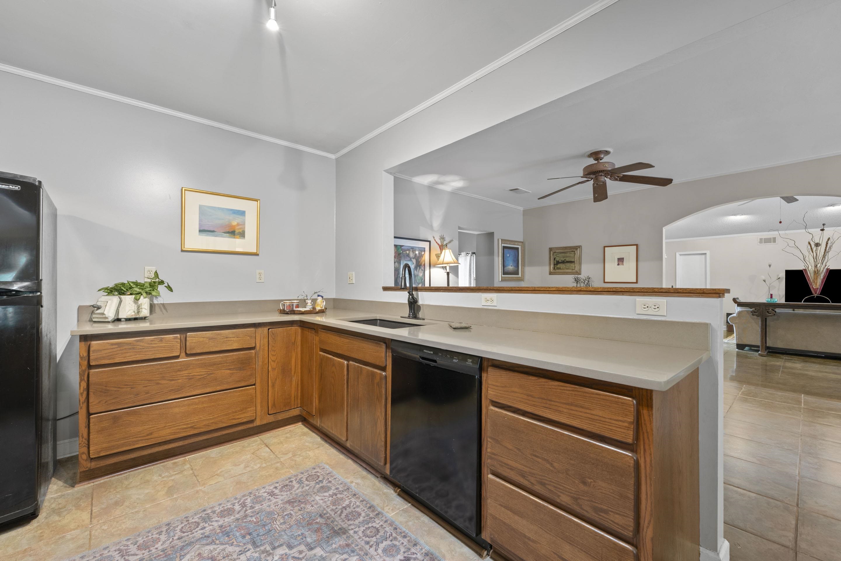 219 North Rose Road Memphis, TN 38117 - Photo 8 of 30 The kitchen opens to the sitting room, which is great for today's busy lifestyle.