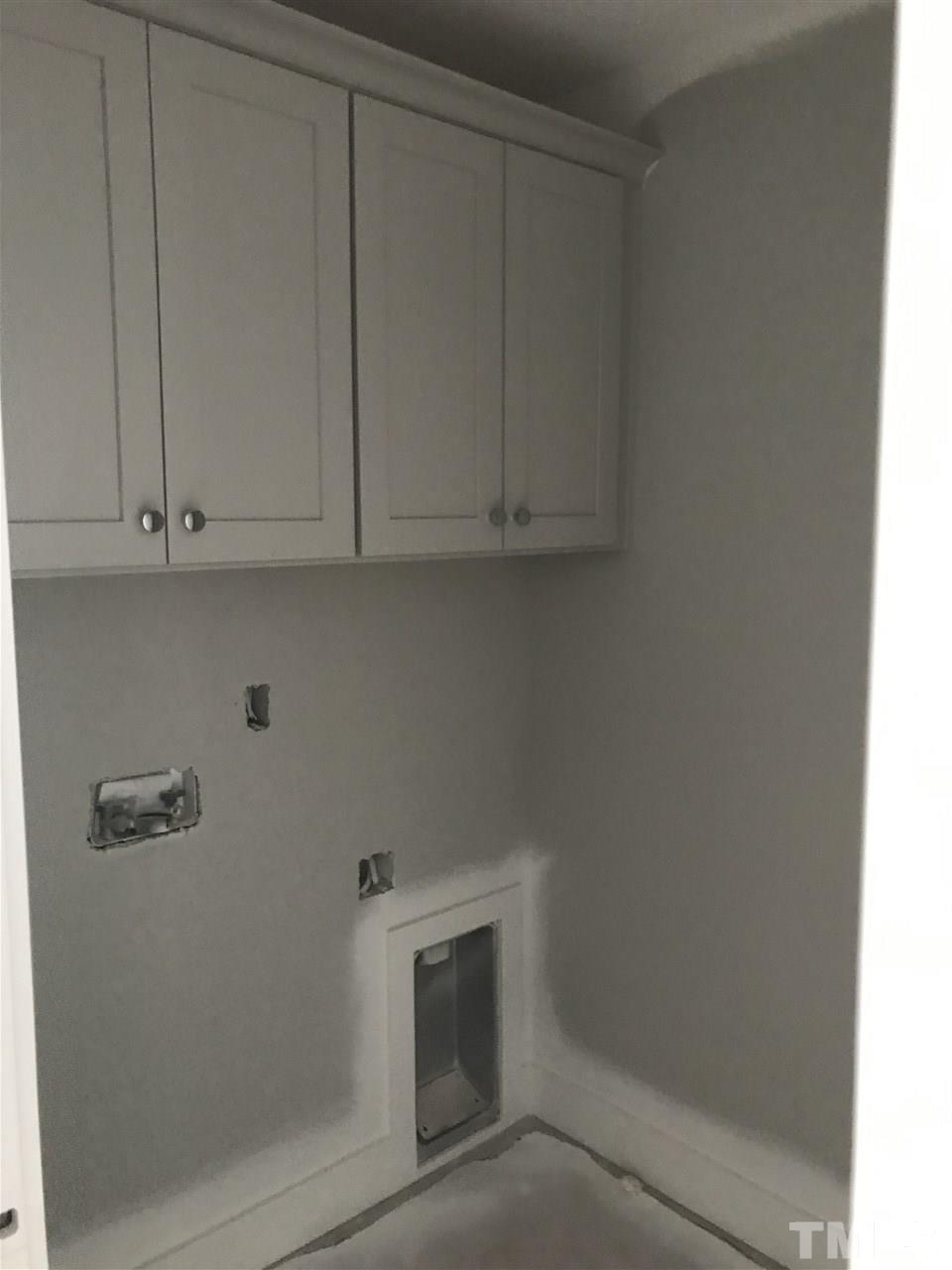 1320 Foxrun Drive Raleigh, NC 27610 - Photo 11 of 24 Tile Floor and Cabinets