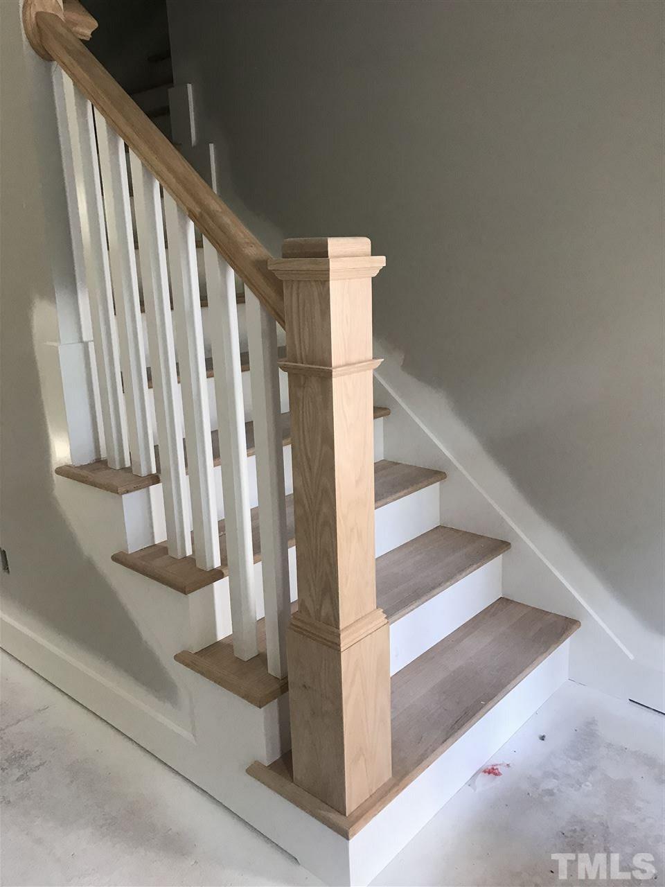 1320 Foxrun Drive Raleigh, NC 27610 - Photo 12 of 24 Site built hardwood stairs w/ open railing and stained newel post