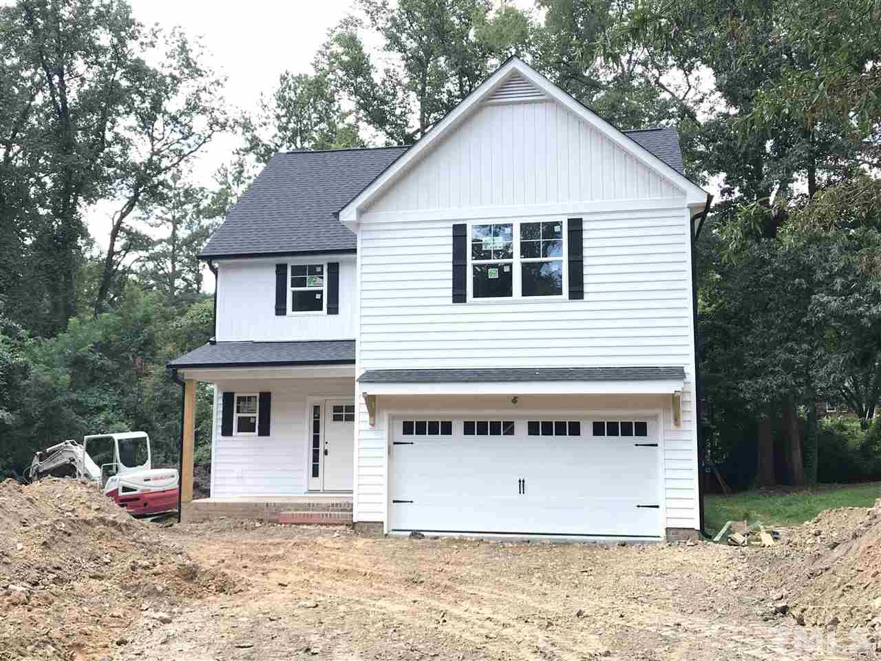 1320 Foxrun Drive Raleigh, NC 27610 - Photo 19 of 24 Garage Door with Glass Panel. Stained Beadboard ceiling on front porch and shed roof. Home built on a crawlspace. Good size driveway for additional parking.