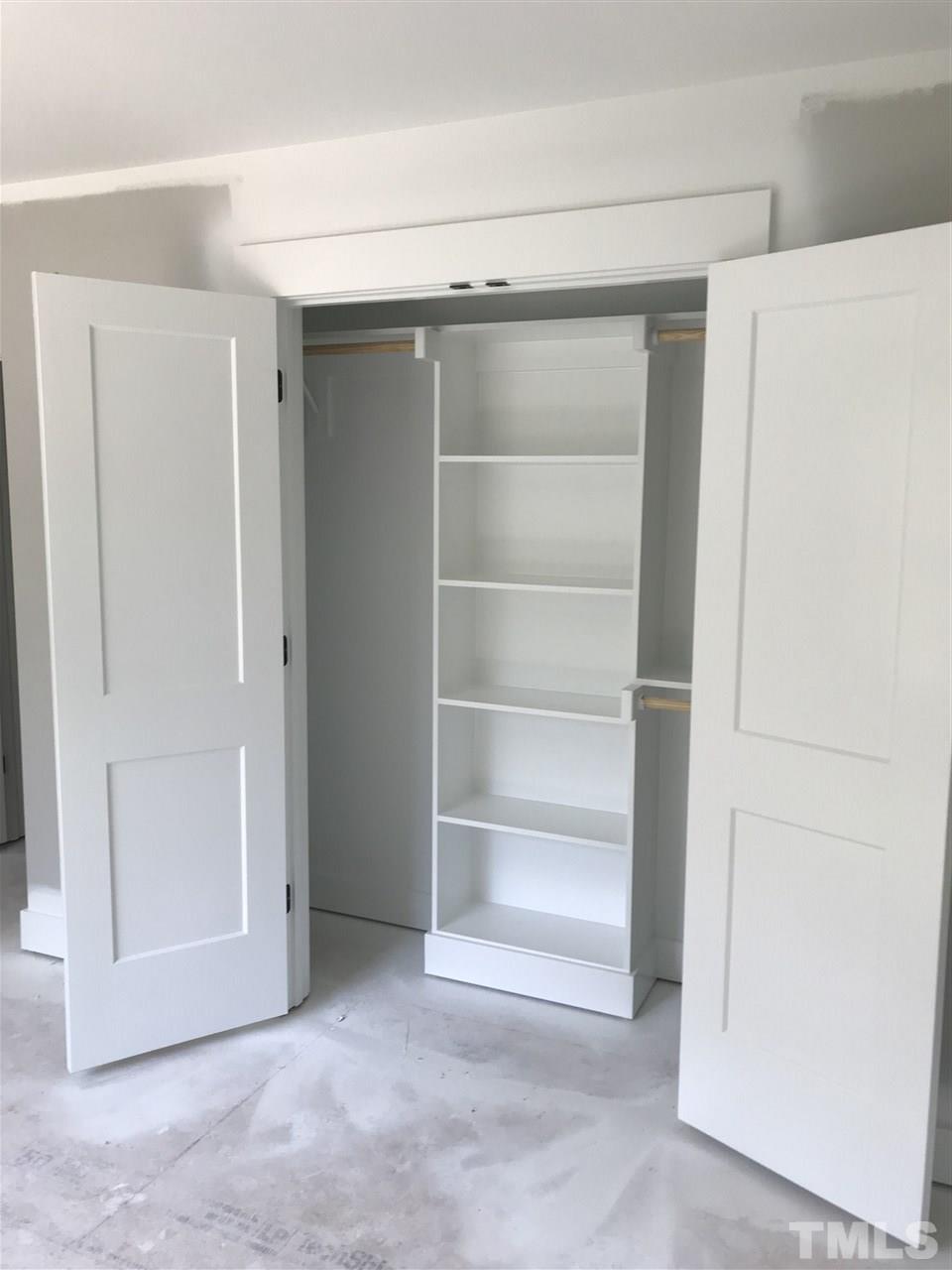 1320 Foxrun Drive Raleigh, NC 27610 - Photo 10 of 24 Wood Shelving in all closets
