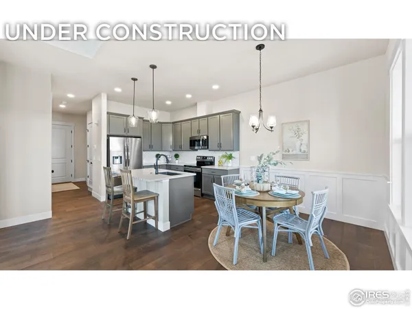 a kitchen and a dining room with furniture