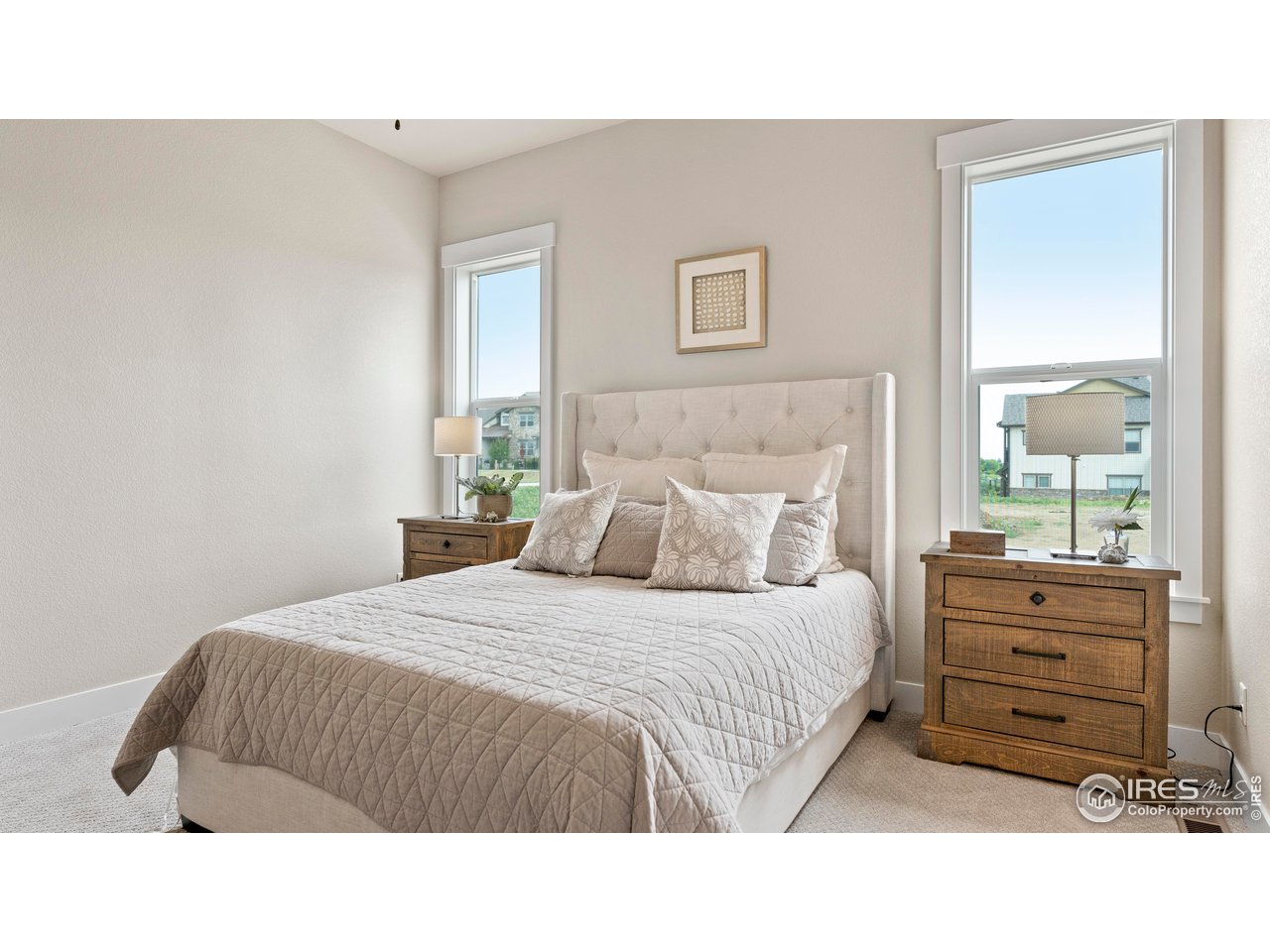 6226 Vernazza Way, Unit 4 Windsor, CO 80550 - Photo 11 of 33 a bedroom with a bed next to a window