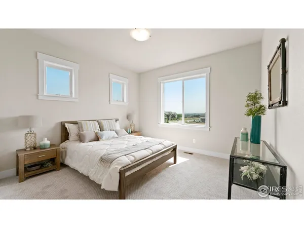 a living room with a bed furniture and a window