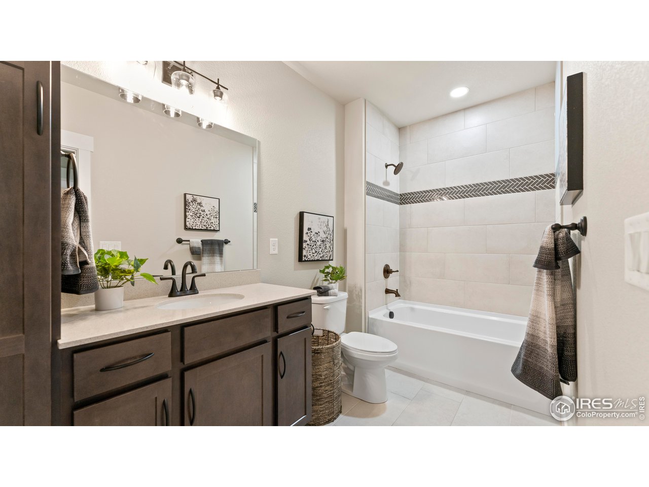 6226 Vernazza Way, Unit 4 Windsor, CO 80550 - Photo 19 of 33 a bathroom with a sink a toilet and shower