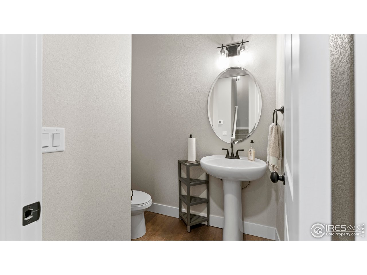 6226 Vernazza Way, Unit 4 Windsor, CO 80550 - Photo 6 of 33 a bathroom with a sink toilet and a mirror