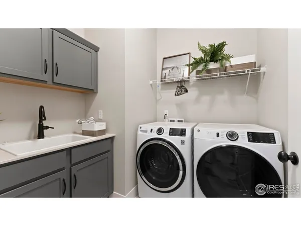 a bathroom with a sink and a washer