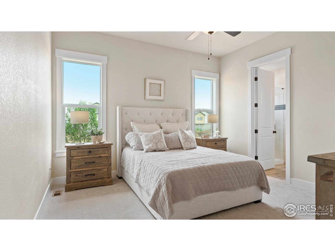 6226 Vernazza Way, Unit 4 Windsor, CO 80550 - Photo 10 of 33 a bedroom with a bed and a window