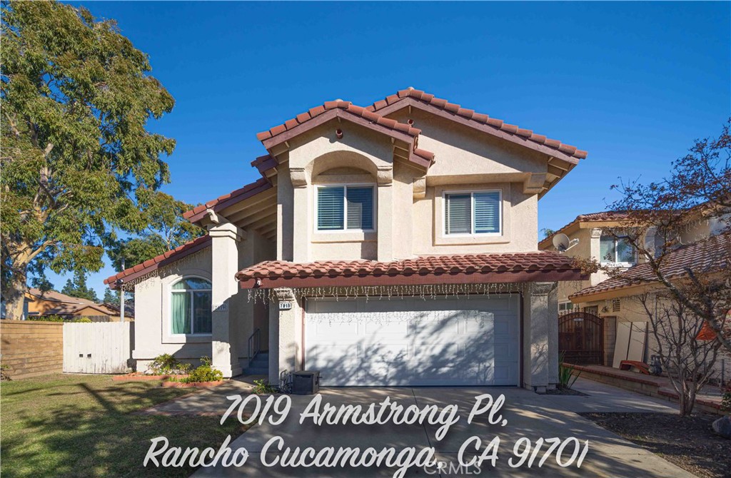7019 Armstrong Place Rancho Cucamonga, CA 91701 - Photo 1 of 1 a front view of a house with a yard