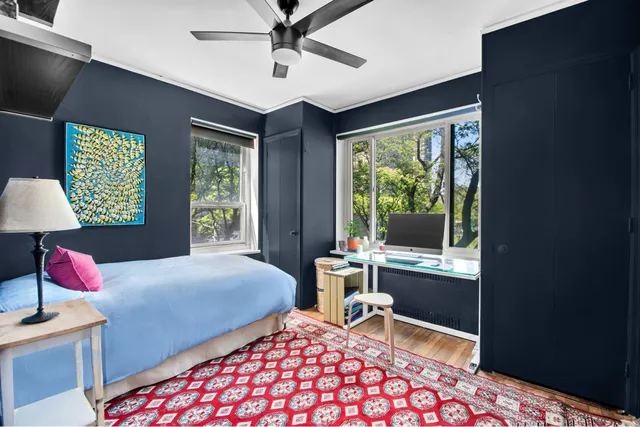 a bathroom with a granite countertop sink a toilet and shower