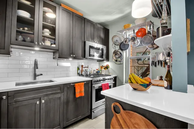 a view of a dining room with furniture and a chandelier
