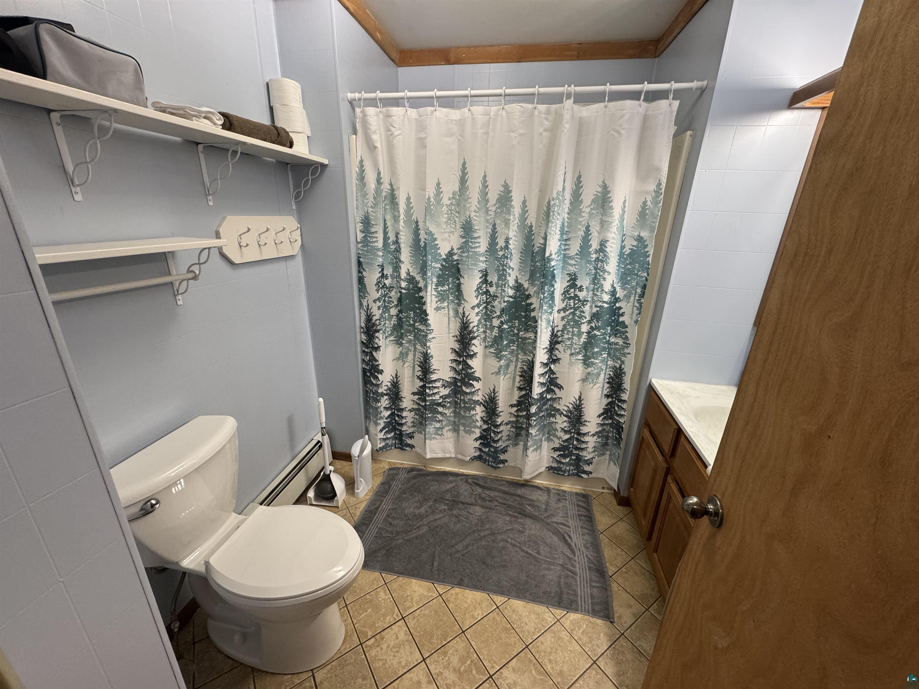 4897 Swanson Drive Maple, WI 54854 - Photo 6 of 25 Bathroom featuring tile flooring, a white toilet, and a vanity with a white countertop