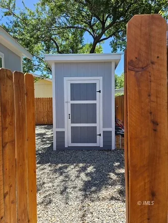a view of a house with a door and wooden door