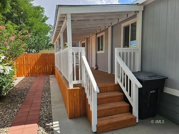 a view of entryway with wooden floor and stairs
