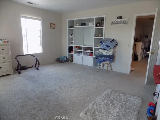 a view of staircase with railing and a window