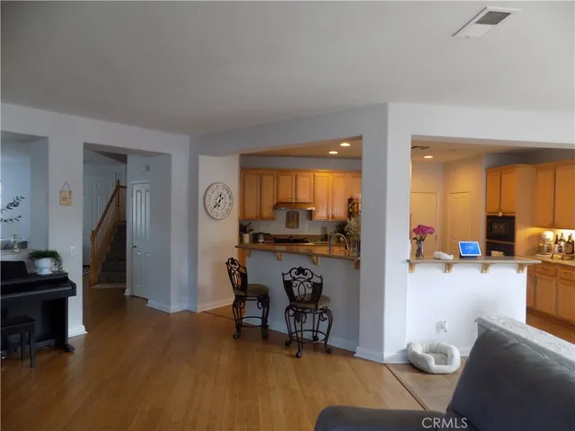 a view of a livingroom with furniture and a flat screen tv