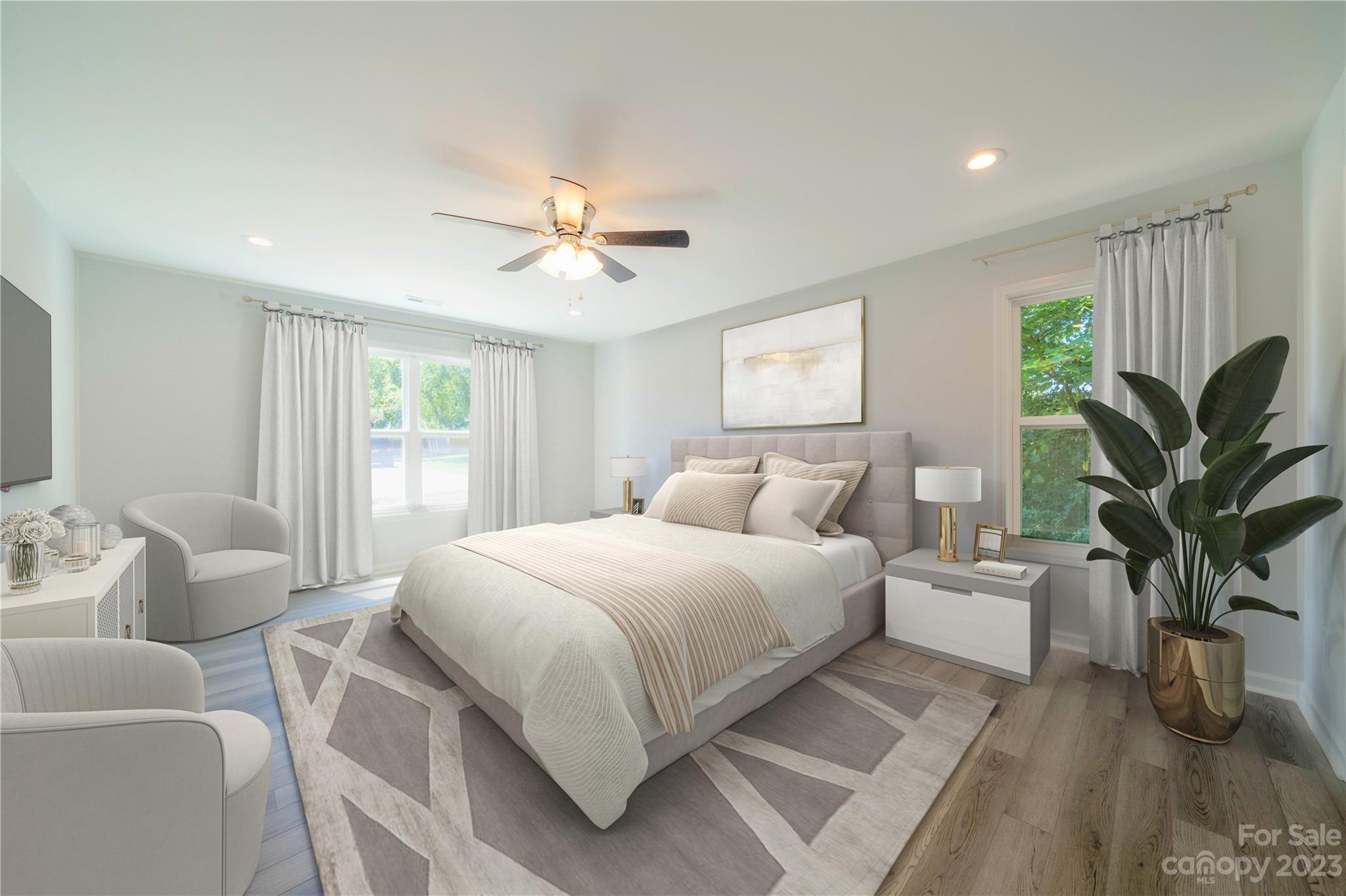 121 Hawkins Loop Salisbury, NC 28144 - Photo 12 of 31 a bedroom with a large bed and a chandelier