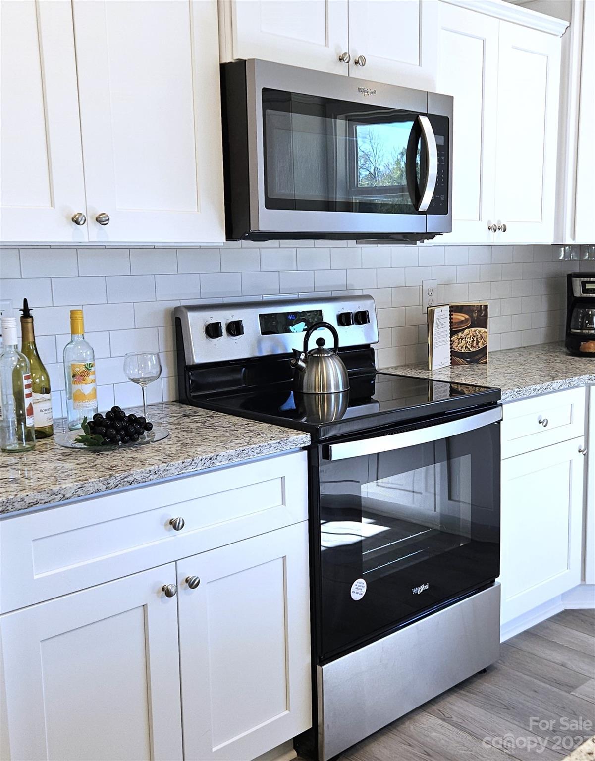 121 Hawkins Loop Salisbury, NC 28144 - Photo 18 of 31 a kitchen with stainless steel appliances granite countertop a stove and a microwave