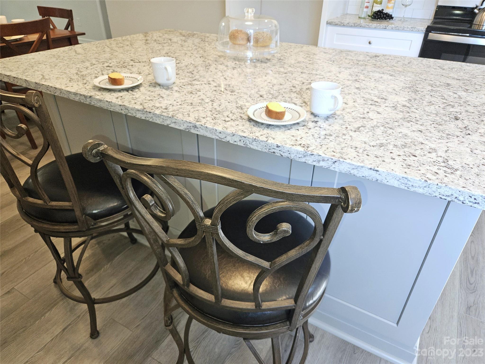 121 Hawkins Loop Salisbury, NC 28144 - Photo 29 of 31 a kitchen with a sink a stove and chairs