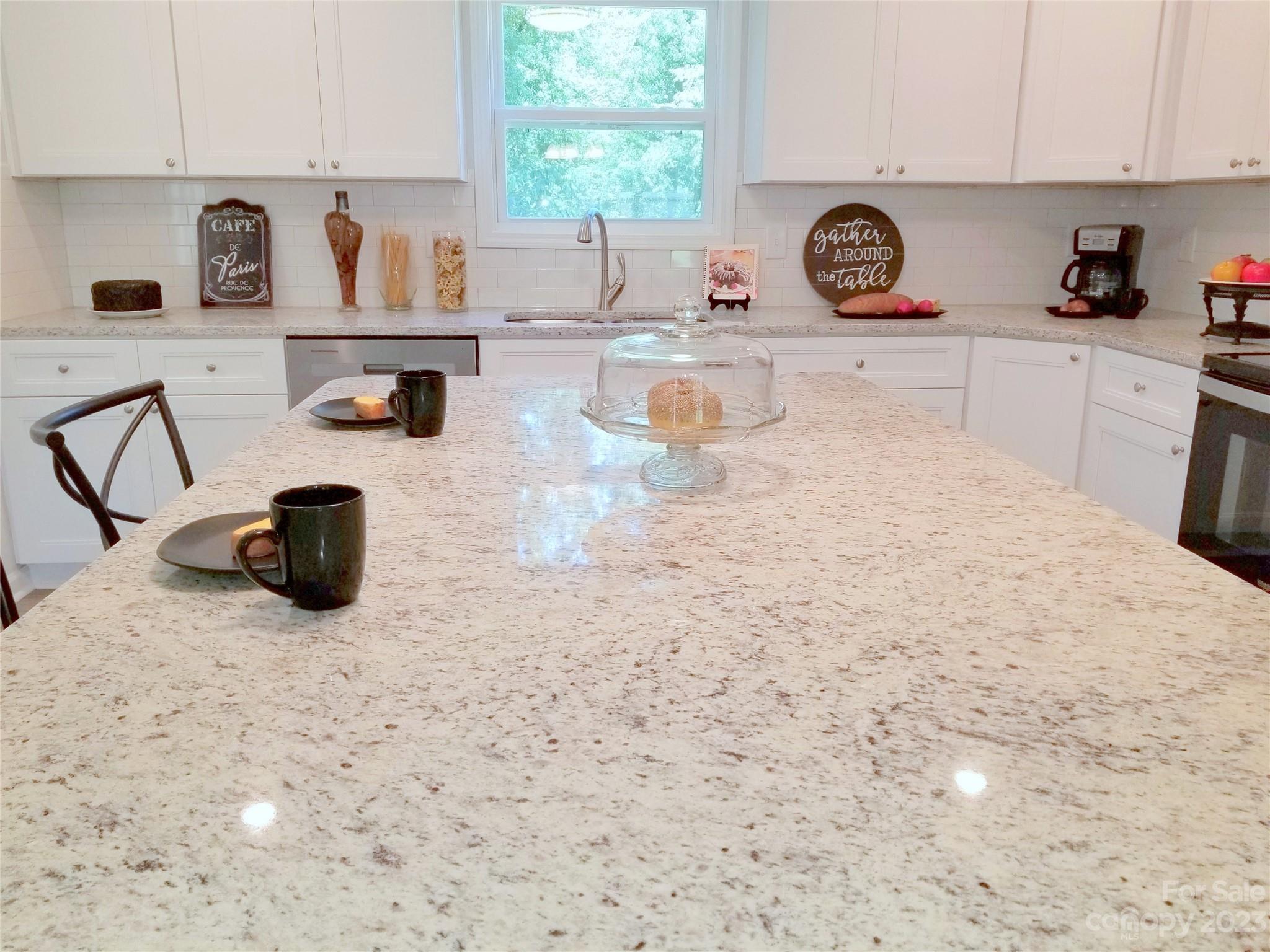 121 Hawkins Loop Salisbury, NC 28144 - Photo 4 of 31 a kitchen with a stove a sink and a white cabinets
