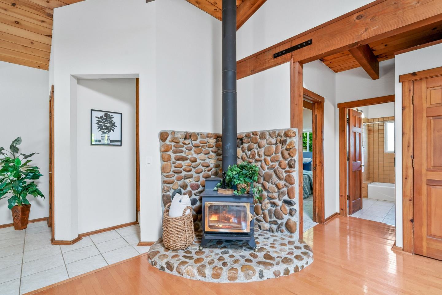 620 Sumner Street Santa Cruz, CA 95062 - Photo 6 of 45 a view of a hallway with wooden floor and a potted plant