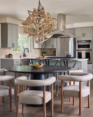 a kitchen with a table and chairs in it