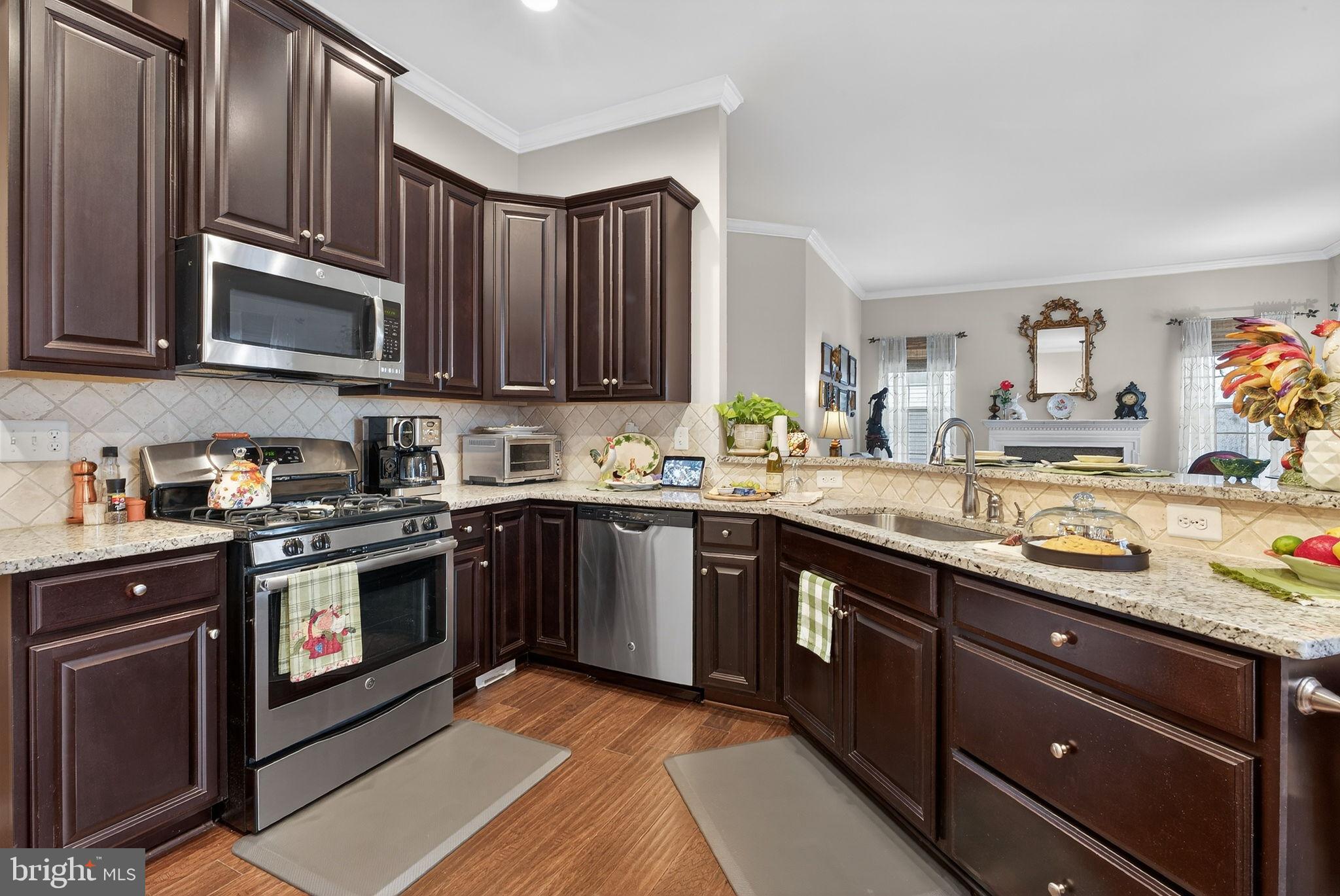 610 Kingsbrook Road Culpeper, VA 22701 - Photo 11 of 43 Modern kitchen with rich cabinetry and style.