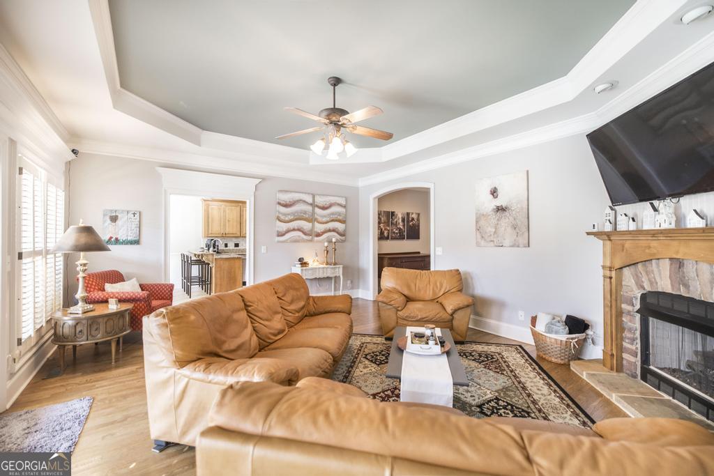 103 Westward Point Kathleen, GA 31047 - Photo 12 of 47 a living room with furniture a flat screen tv and a fireplace