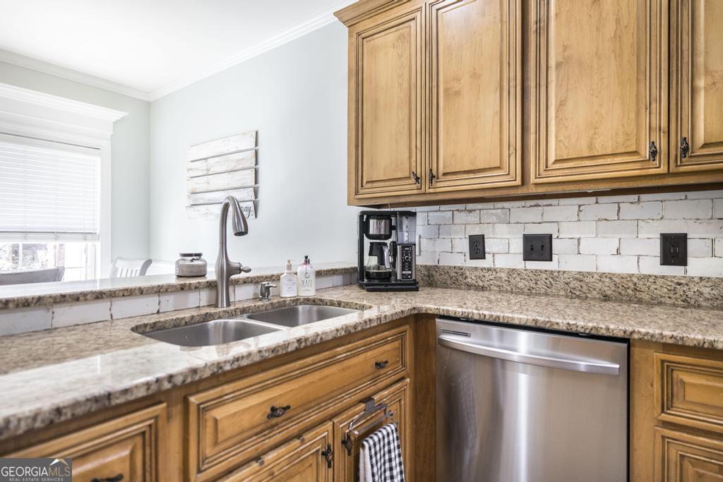 103 Westward Point Kathleen, GA 31047 - Photo 16 of 47 a kitchen with granite countertop stainless steel appliances a sink and cabinets