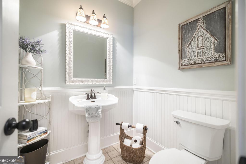 103 Westward Point Kathleen, GA 31047 - Photo 22 of 47 a bathroom with a toilet sink and mirror