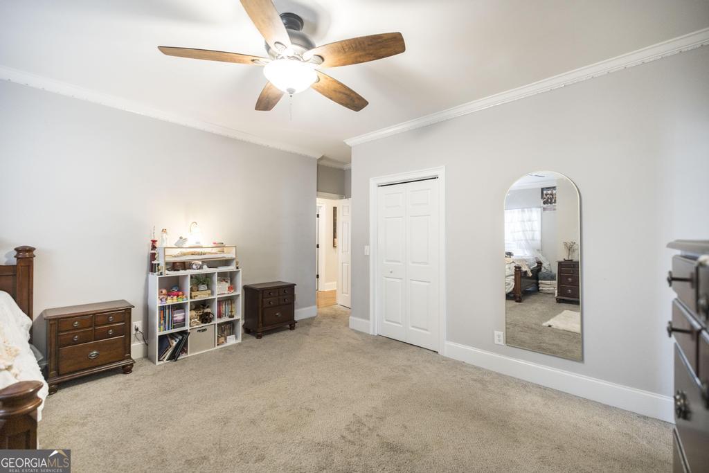 103 Westward Point Kathleen, GA 31047 - Photo 30 of 47 a view of a livingroom with furniture and a ceiling fan