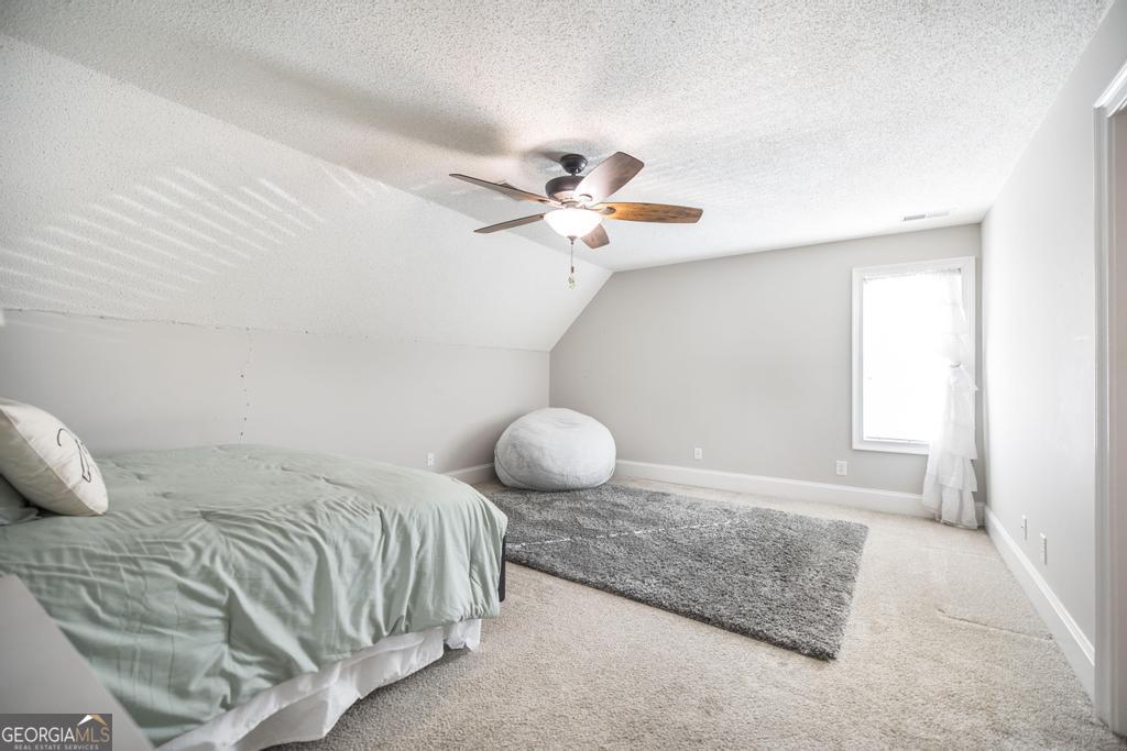 103 Westward Point Kathleen, GA 31047 - Photo 32 of 47 a bedroom with a bed and window