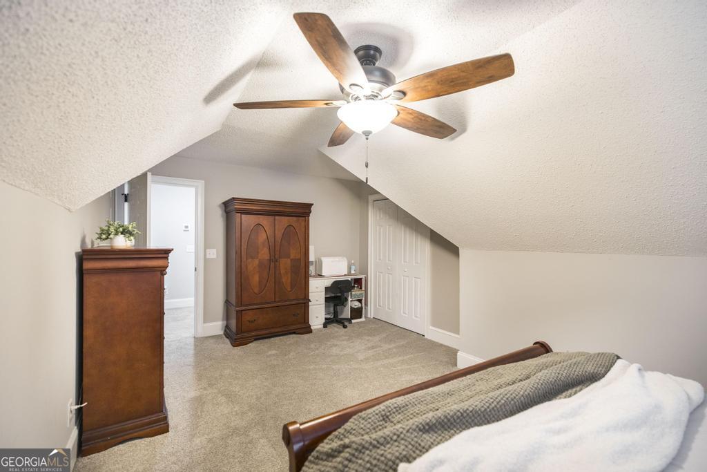 103 Westward Point Kathleen, GA 31047 - Photo 36 of 47 a bedroom with a bed and a ceiling fan