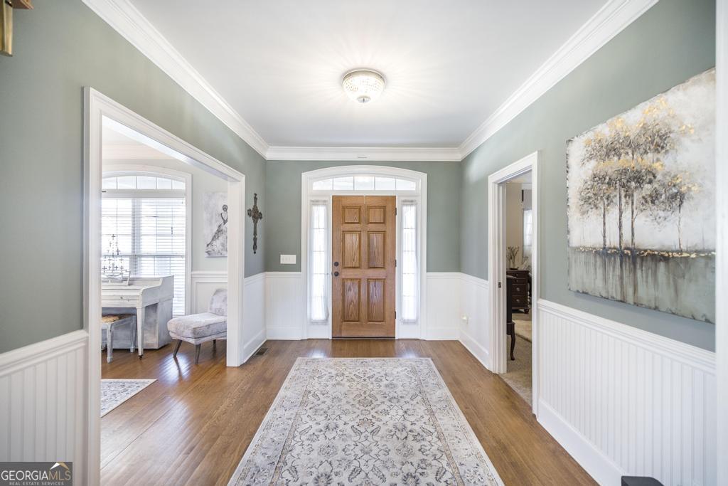 103 Westward Point Kathleen, GA 31047 - Photo 8 of 47 a living room with furniture and a wooden floor