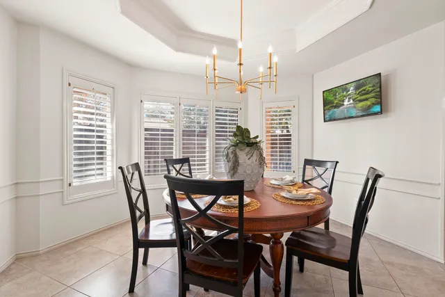 a view of a dining room with furniture and window