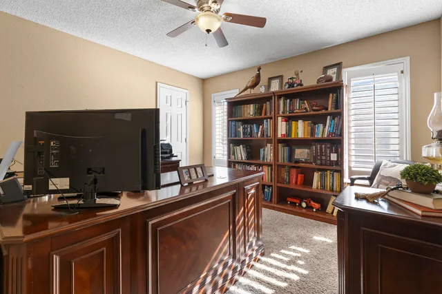 a view of a workspace with furniture