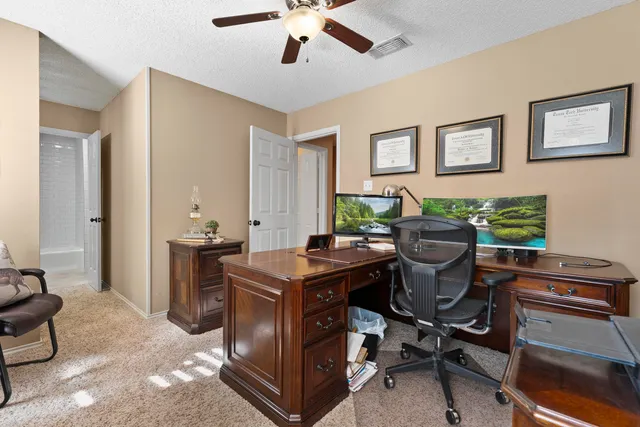 a view of a workspace with furniture