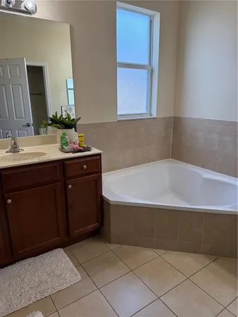 a bathroom with a bathtub and a sink