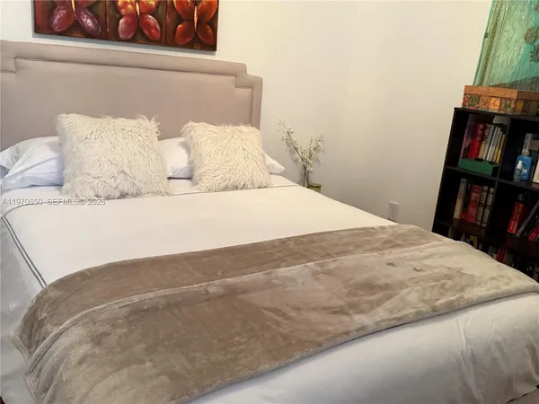 a bedroom with a bed and closet