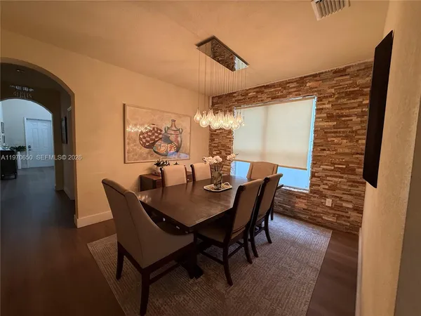 a view of a dining room with furniture