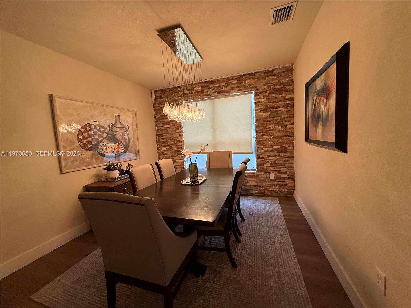 17012 Southwest 91st Street Miami, FL 33196 - Photo 6 of 22 a view of a dining room with furniture window and outside view