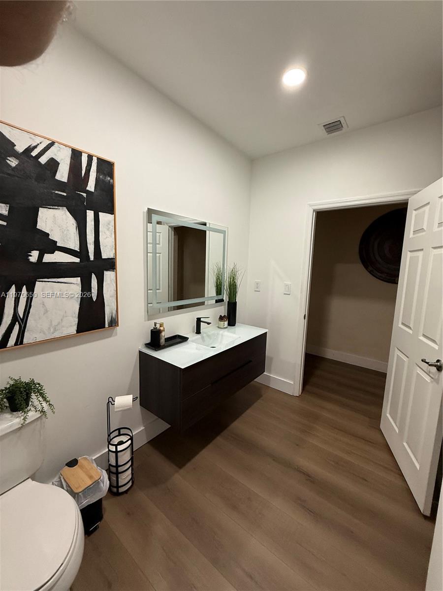 17012 Southwest 91st Street Miami, FL 33196 - Photo 8 of 22 a view of bathroom with dual sinks